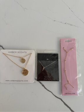 Fabfitfun jewelry bundle. Crystal haze hand chain, the giving keys, amber sceats